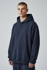 WharfPrint navy blue heavyweight cotton pullover hoodie with a relaxed fit, drop shoulders, and front kangaroo pocket.